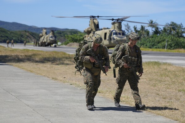 U.S. soldiers disembark inside the Naval Base Camilo Osias in Santa Ana, Cagayan province, northern Philippines after participating in joint military exercises on Monday, May 6, 2024. The United States and the Philippines, which are longtime treaty allies, have identified the far-flung coastal town of Santa Ana in the northeastern tip of the Philippine mainland as one of nine mostly rural areas where rotating batches of American forces could encamp indefinitely and store their weapons and equipment within local military bases under the Enhanced Defense Cooperation Agreement, or EDCA. (AP Photo/Aaron Favila)