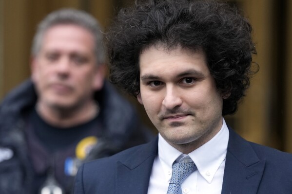 FILE - Sam Bankman-Fried leaves Manhattan federal court in New York on Feb. 16, 2023. A slimmed down, foot-tapping FTX founder Sam Bankman-Fried made a brief appearance in a Federal courtroom in New York, Wednesday, Feb. 21, 2024, to switch lawyers before his sentencing next month. (AP Photo/Seth Wenig, File)