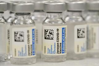 FILE - This Saturday, March 6, 2021 file photo shows vials of Johnson & Johnson COVID-19 vaccine at a pharmacy in Denver. On Thursday, June 10, 2021, Johnson & Johnson said that the U.S. Food and Drug Administration extended the expiration date on millions of doses of its COVID-19 vaccine by an extra six weeks. (AP Photo/David Zalubowski, File)
