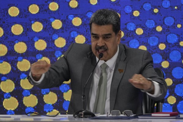 Venezuela's President Nicolas Maduro speaks during the notification ceremony for the referendum about the future of a disputed territory with Guyana, in Caracas, Venezuela, Monday, Dec. 4, 2023. (APPhoto/Ariana Cubillos)