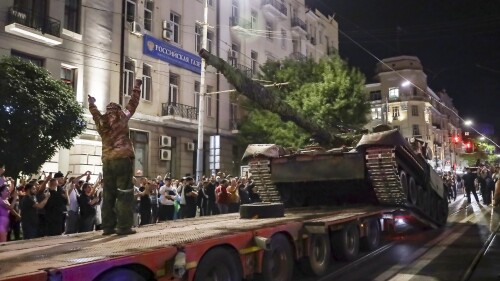 FILE - Members of the Wagner Group military company load their tank onto a truck on a street in Rostov-on-Don, Russia, Saturday, June 24, 2023, before leaving an area at the Southern Military District headquarters.  (AP Photo, File)