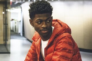 
              This undated image provided by Columbia Records shows rapper Lil Nas X, whose viral hit “Old Town Road” was removed from Billboard's country charts because they said it wasn’t country enough. (Eric Lagg/Courtesy of Columbia Records via AP)
            