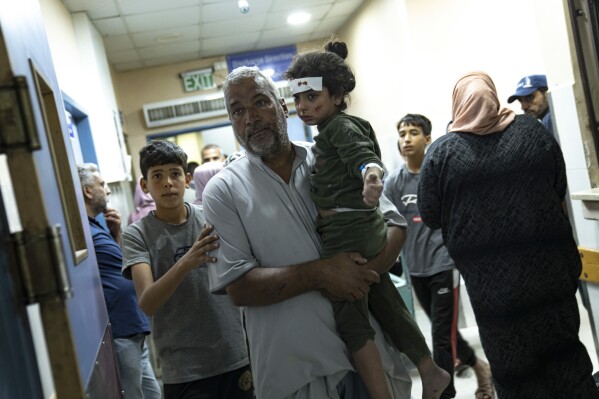 Palestinians wounded in Israeli bombardment of the Gaza Strip arrive at a hospital in Khan Younis Monday, Oct.16, 2023. (AP Photo/Fatima Shbair)