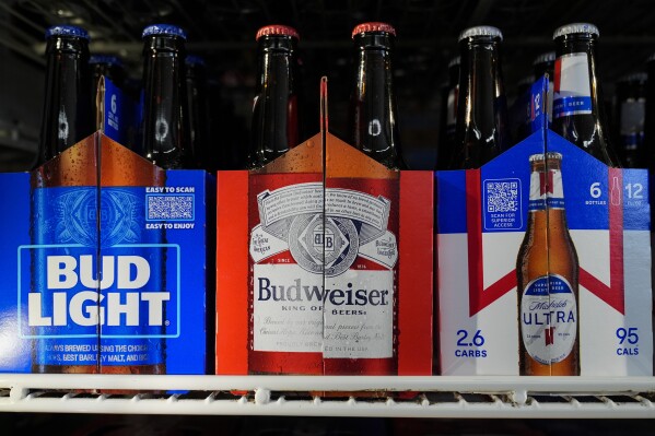 Six-packs of Bud Light, Budweiser and Michelob Ultra are displayed at a liquor store, Wednesday, Feb. 28, 2024, in Fairfield, Calif. Budweiser brewer Anheuser-Busch has reached a contract agreement with the Teamsters union that avoids a strike at its U.S. plants. The union had threatened a strike at the brewer’s 12 U.S. plants if an agreement on a new five-year contract wasn’t reached by 11:59 p.m. EST Thursday. (AP Photo/Godofredo A. Vásquez)