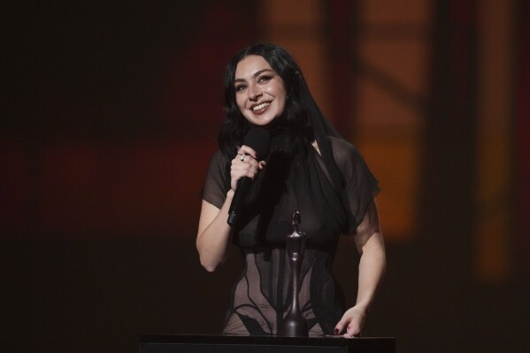 EDS NOTE: NUDITY - Charli xcx accepts the artist of the year award during the Brit Awards 2025 in London, Saturday, March 1, 2025. (Photo by Scott A Garfitt/Invision/AP)