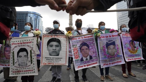 FILE - Relatives and classmates of the missing 43 Ayotzinapa college students march in Mexico City, Sept. 26, 2022, on the anniversary of their disappearance in Iguala, Guerrero state. Eight soldiers linked to the disappearance of the student teachers in 2014, were arrested and are in a military prison awaiting a civil judge to determine whether to open criminal proceedings against them, reported an Army commander, Thursday, June 22, 2023. (AP Photo/Marco Ugarte, File)