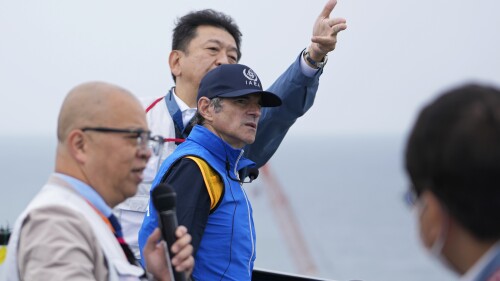 Rafael Mariano Grossi, Director General of the International Atomic Energy Agency, center, listens to Tomoaki Kobayakawa, President of Tokyo Electric Power Co., center back, explain facilities to be used to release treated wastewater, while visiting the damaged Fukushima nuclear power plant in Futaba, northeastern Japan, Wednesday, July 5, 2023. (AP Photo/Hiro Komae, Pool)