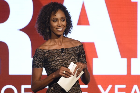FILE - Sage Steele speaks at the 15th annual High School Athlete of the Year Awards in Marina del Rey, Calif., July 11, 2017. ESPN and host Sage Steele have settled the lawsuit she filed after disciplined for comments she made about the COVID-19 vaccine and parted ways. Steele posted on social media Tuesday, Aug. 15, 2023, that she is leaving the company in order to speak more freely. (AP Photo/Chris Pizzello, File)