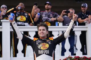 Noah Gragson celebrates after he won the NASCAR Xfinity Series auto race at Pocono Raceway, Saturday, July 23, 2022 in Long Pond, Pa. (AP Photo/Matt Slocum)