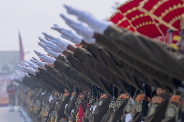 New recruited Indian Border Security Force soldiers take oath during their graduation parade ceremony in Humhama, outskirts of Srinagar, Indian controlled Kashmir, Thursday, Nov. 9, 2023. A total of 599 recruits were formally inducted into the BSF during the ceremony. (AP Photo/Dar Yasin)