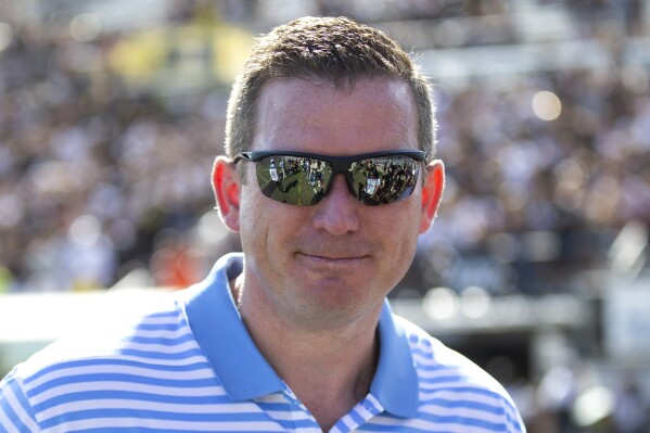Then-Central Florida athletic director Danny White stands on the sideline at the team's NCAA college football game against Houston, Nov. 2, 2019, in Orlando, Fla. (AP Photo/Willie J. Allen Jr., File)