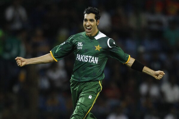 FILE - Pakistan's bowler Umar Gul runs to celebrate after taking the wicket of New Zealand's batsman Brendon McCullum, not seen, during their ICC Twenty20 Cricket World Cup match in Pallekele, Sri Lanka, on Sept. 23, 2012. The Pakistan Cricket Board appointed former international players Umar Gul and Saeed Ajmal as bowling coaches for the national team on Tuesday, Nov. 21, 2023. (AP Photo/Aijaz Rahi, File)