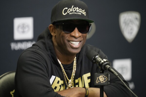 Colorado head coach Deion Sanders responds to questions during a news conference after the team's NCAA college football practice at the university Friday, Aug. 4, 2023, in Boulder, Colo. (AP Photo/David Zalubowski)