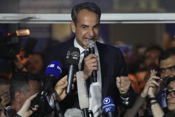Greece's Prime Minister and leader of New Democracy Kyriakos Mitsotakis addresses supporters at the headquarters of his party in Athens, Greece, Sunday, May 21, 2023. The conservative party of Greek Prime Minister Kyriakos Mitsotakis has won a landslide election but without enough parliamentary seats to form a government. (AP Photo/Petros Giannakouris)