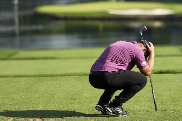 Tyrrell Hatton, of England, reacts to his tee shot on the 17th hole during the first round of the PGA Championship golf tournament at the Quail Hollow Club, Thursday, May 15, 2025, in Charlotte, N.C. (AP Photo/David J. Phillip)