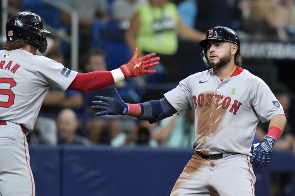 Boston Red Sox's Wilyer Abreu, right, celebrates his two-run home run off Tampa Bay Rays relief pitcher Kevin Kelly with Jarren Duran during the sixth inning of a baseball game Wednesday, May 22, 2024, in St. Petersburg, Fla. (AP Photo/Chris O'Meara)