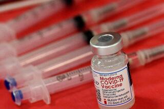 FILE - Syringes and a vial of the Moderna COVID-19 vaccine are displayed at a mass COVID-19 vaccination site in Batavia, Ill., on March 19, 2021. Moderna hopes to offer updated COVID-19 boosters in the fall that combine its original vaccine with protection against the omicron variant. On Tuesday, April 19, 2022, it reported a preliminary hint that such an approach might work. (Rick West/Daily Herald via AP, File)