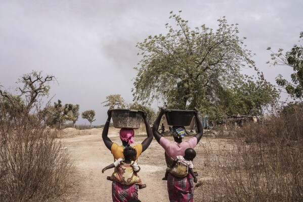 Women work at a gold mining site in the Kedougou region of Senegal on Thursday, Jan. 16, 2025. (AP Photo/Annika Hammerschlag)