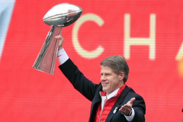 FILE - Kansas City Chiefs owner Clark Hunt holds the Super Bowl trophy during a rally in Kansas City, Mo., Wednesday, Feb. 5, 2020. It had been 50 years between Super Bowl trips. The always-pragmatic Hunt uses that stretch in football's wilderness to keep the current ride in the proper perspective. (AP Photo/Orlin Wagner, File)