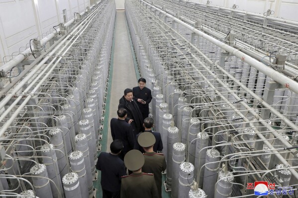 In this undated photo provided Wednesday, Jan. 29, 2025, by the North Korean government, its leader Kim Jong Un, second from top, inspects a facility that produces nuclear material at an undisclosed location in North Korea. Independent journalists were not given access to cover the event depicted in this image distributed by the North Korean government. The content of this image is as provided and cannot be independently verified. Korean language watermark on image as provided by source reads: "KCNA" which is the abbreviation for Korean Central News Agency. (Korean Central News Agency/Korea News Service via AP)