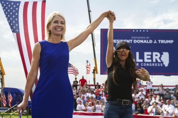 Rep. Mary Miller, R-Ill., left, is joined by Rep. Lauren Boebert, R-Colo., on stage at a rally at the Adams County Fairgrounds in Mendon, Ill., Saturday, June 25, 2022. (Mike Sorensen/Quincy Herald-Whig via AP)