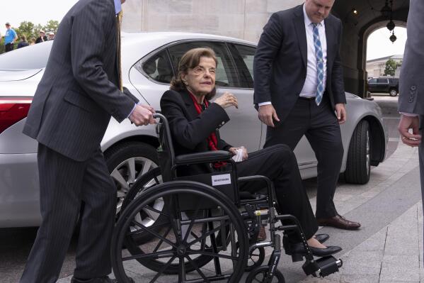 FILE - Sen. Dianne Feinstein, D-Calif., is assisted to a wheelchair by staff as she returns to the Senate after a more than two-month absence, at the Capitol in Washington, Wednesday, May 10, 2023. Feinstein's ongoing medical struggles have raised a sensitive political question with no easy answer: Who would California Democratic Gov. Gavin Newsom pick to replace her if the seat became vacant? (AP Photo/J. Scott Applewhite, File)