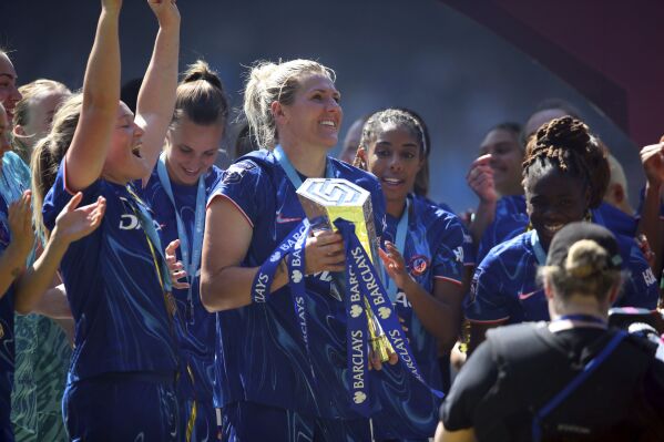 Chelsea's Millie Bright holds the Women's Super League trophy at Stamford Bridge, London, Saturday May 10, 2025. (Rhianna Chadwick/PA via AP)