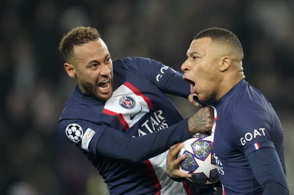 FILE - PSG's Kylian Mbappe, right, celebrates with PSG's Neymar after scoring a disallowed goal during the Champions League round of 16 first leg soccer match between Paris Saint Germain and Bayern Munich, at the Parc des Princes stadium, in Paris, France, Tuesday, Feb. 14, 2023. (AP Photo/Christophe Ena, File)
