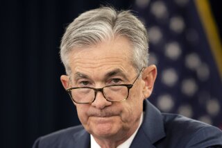 FILE - In this July 31, 2019, file photo, Federal Reserve Chairman Jerome Powell speaks during a news conference following a two-day Federal Open Market Committee meeting in Washington. President Donald Trump is calling on the Federal Reserve to cut interest rates by at least a full percentage-point “over a fairly short period of time,” saying such a move would make the U.S. economy even better and would also “greatly and quickly” enhance the global economy. In two tweets Monday, Aug. 19, Trump kept up his pressure on the Fed and Powell, saying the U.S. economy was strong “despite the horrendous lack of vision by Jay Powell and the Fed.” (AP Photo/Manuel Balce Ceneta, File)