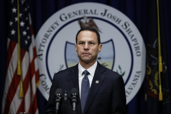 
              FILE - In this Aug. 14, 2018, file photo, Pennsylvania Attorney General Josh Shapiro walks to the podium to speak about a grand jury's report on clergy abuse in the Roman Catholic Ch...