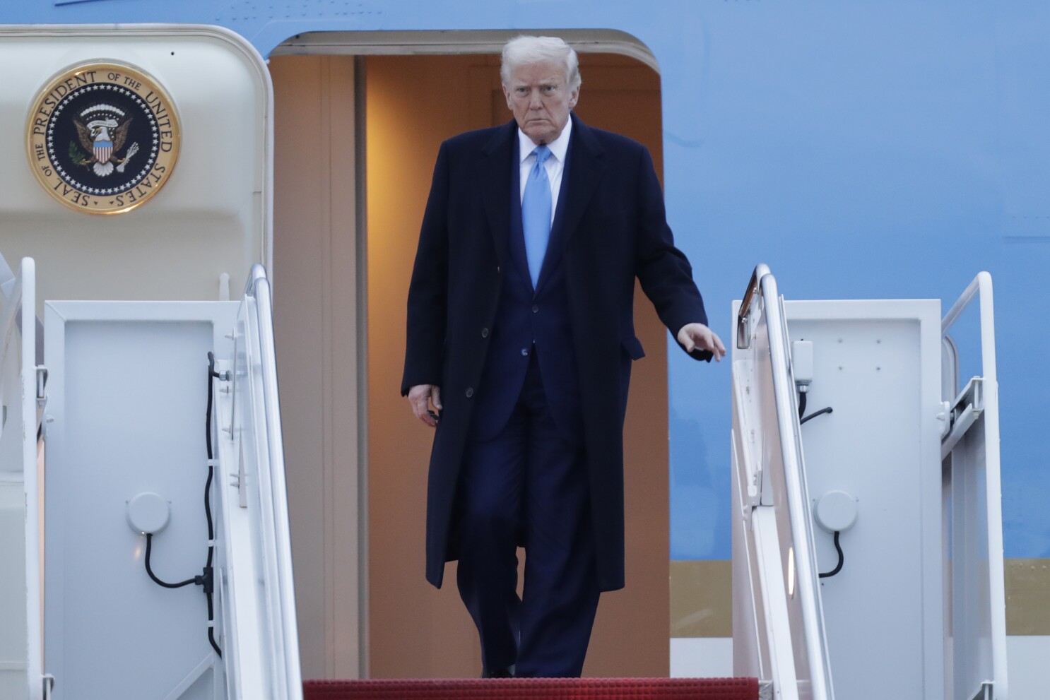 Trump says he won't back down on tariffs as markets reel
