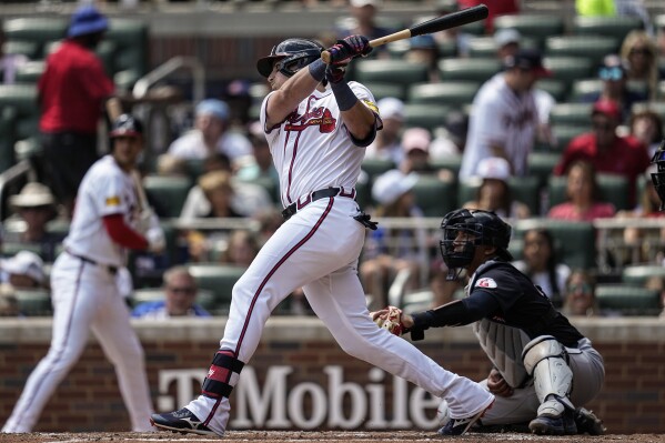 Atlanta Braves third baseman Austin Riley (27) hits a single against the Cleveland Guardians in the fourth inning of a baseball game, Sunday, April 28, 2024, in Atlanta. (AP Photo/Mike Stewart)