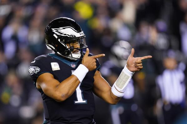 Philadelphia Eagles quarterback Jalen Hurts celebrates a touchdown run by Kenneth Gainwell during the first half of an NFL football game against the Green Bay Packers, Sunday, Nov. 27, 2022, in Philadelphia. (AP Photo/Chris Szagola)