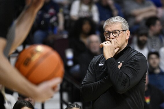 FILE - UConn coach Geno Auriemma watches during the first half of the team's NCAA college basketball game against Marquette in the semifinals of the Big East women's tournament March 10, 2024, in Uncasville, Conn. UConn announced a five-year extension for Auriemma on Tuesday, June 4. (AP Photo/Jessica Hill, File)