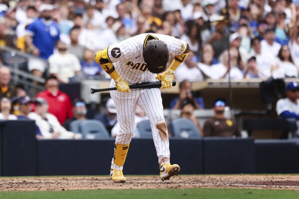 San Diego Padres' Luis Arraez reacts after hitting a pop fly for an out to Los Angeles Dodgers' Freddie Freeman in the seventh inning of a baseball game Wednesday, June 11, 2025, in San Diego. (AP Photo/Derrick Tuskan)