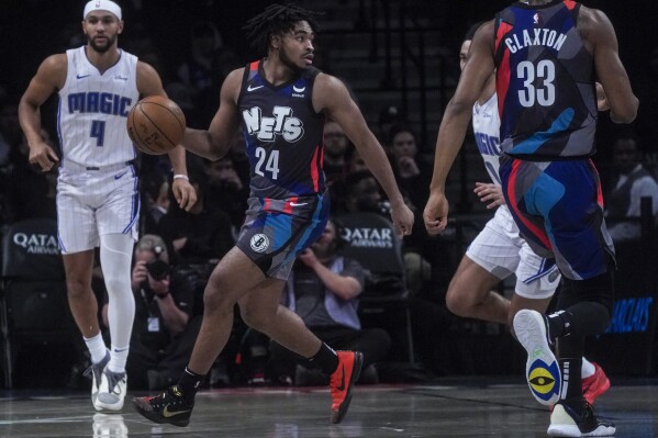 Brooklyn Nets' guard Cam Thomas, second from left, dribbles during an NBA basketball game against the Orlando Magic, Saturday, Dec. 2, 2023, in New York. (AP Photo/Bebeto Matthews)