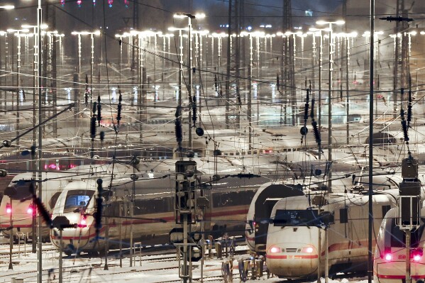 Deutsche Bahn ICE trains are parked on the tracks at the DB Fernverkehr plant in Hamburg, Germany Wednesday, Jan. 10, 2024. A union representing many of Germany’s train drivers started a nearly three-day strike early Wednesday in a rancorous dispute with the country’s state-owned main railway operator over working hours and pay. (Christian Charisius/dpa via AP)
