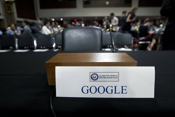 
              An empty chair reserved for Google's parent Alphabet, which refused to send its top executive, is seen as Facebook COO Sheryl Sandberg accompanied by Twitter CEO Jack Dorsey testify before the Senate Intelligence Committee hearing on 'Foreign Influence Operations and Their Use of Social Media Platforms' on Capitol Hill, Wednesday, Sept. 5, 2018, in Washington. Google CEO did not show for the hearing. (AP Photo/Jose Luis Magana)
            