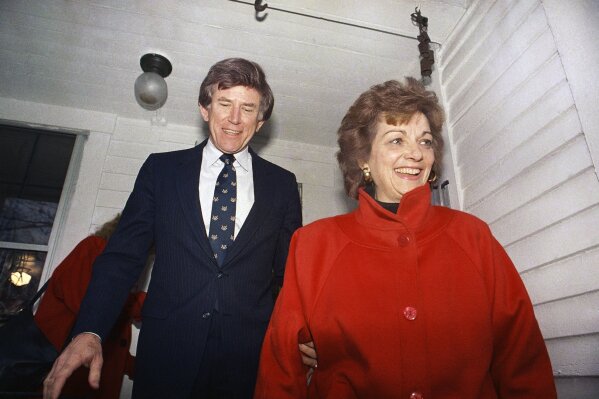 FILE - In this Dec. 15, 1987 file photo, Former Colorado Sen. Gary Hart and his wife Lee are all smiles as they leave the home, Dec. 15, 1987 of a Concord supporter enroute to the New Hampshire Secretary of State's office in Concord, N.H.. Lee Hart, the wife of former U.S. Sen. Gary Hart of Colorado, has died Friday, April 9, 2021 . She was 85.(AP Photo/Chris Cardner)