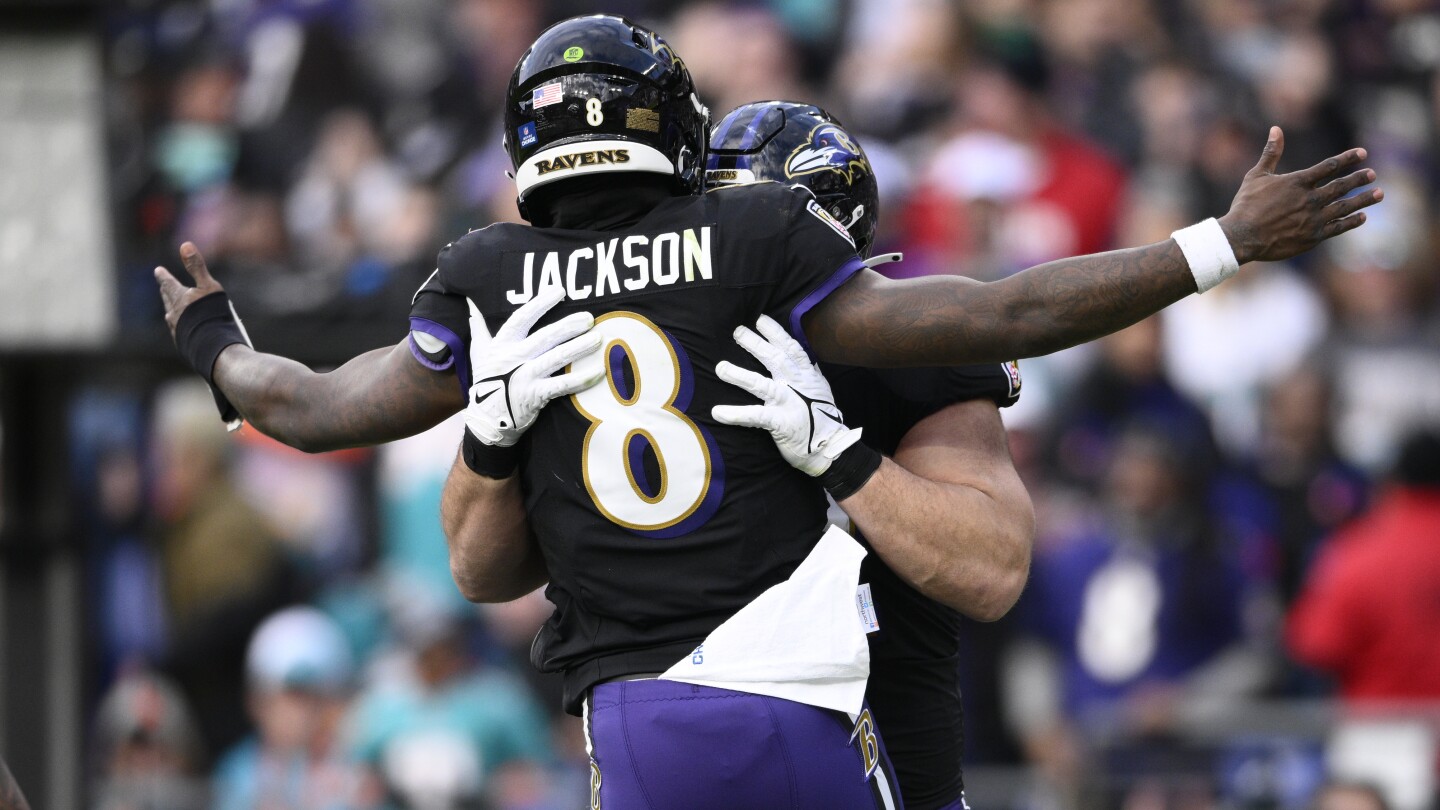 Lamar Jackson’s perfect passer rating helps Ravens rout Dolphins 56-19 to clinch top seed in AFC