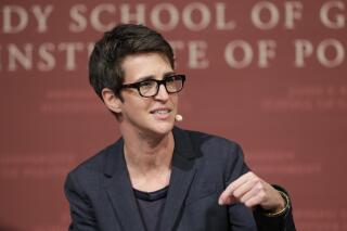 FILE - MSNBC television anchor Rachel Maddow, host of "The Rachel Maddow Show," moderates a panel at the John F. Kennedy School of Government, at Harvard University, in Cambridge, Mass., on Oct. 16, 2017. Maddow's "Deja News," a podcast she's made with longtime producer Isaac-Davy Aronson that looks at historical incidents that can teach us lessons about current events. (AP Photo/Steven Senne, File)