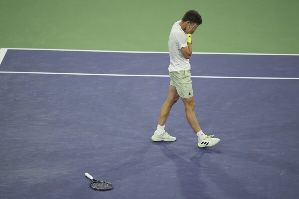 Luca Nardi, of Italy, celebrates after upsetting Novak Djokovic, of Serbia, at the BNP Paribas Open tennis tournament Monday, March 11, 2024, in Indian Wells, Calif. Nardi won 6-4, 3-6, 6-3. (AP Photo/Mark J. Terrill)