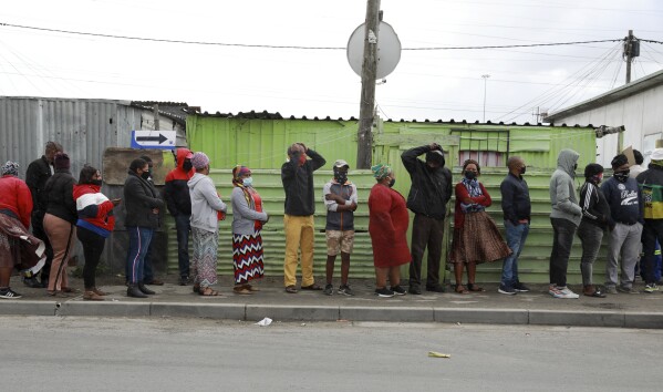 People queue outside a polling station in Khayelitsha in Cape Town, South Africa, Monday, Nov. 1, 2021. (AP Photo/Nardus Engelbrecht, File)