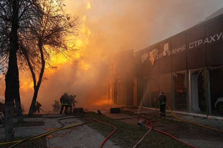 Firefighters work to extinguish a fire in a destroyed building after a Russian attack in Kyiv, Ukraine, Tuesday, Jan. 2, 2024. (AP Photo/Efrem Lukatsky)