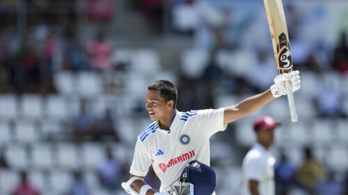 India's Yashasvi Jaiswal celebrates after he scored a century against West Indies on day two of their first cricket Test match at Windsor Park in Roseau, Dominica, Thursday, July 13, 2023. (AP Photo/Ricardo Mazalan)
