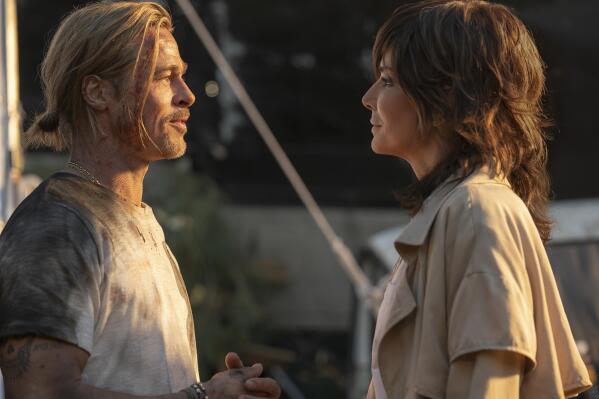 This image released by Sony Pictures shows Brad Pitt, left, and Sandra Bullock in a scene from the film "Bullet Train."  (Scott Garfield/Sony Pictures via AP)