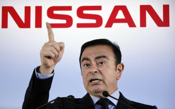 FILE - In this May 11, 2012, file photo, then Nissan Motor Co. President and CEO Carlos Ghosn speak during a press conference in Yokohama, near Tokyo. A close friend says Monday, Dec. 30, 2019 that Ghosn, who is awaiting trial in Japan, has arrived in Beirut. It was not clear how Ghosn, who is of Lebanese origins, left Japan where he is under surveillance and is expected to face trial in April 2020. (AP Photo/Koji Sasahara, File)