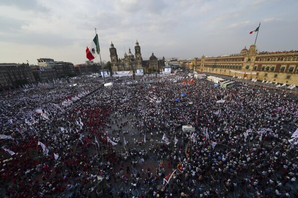 Supporters of presidential candidate Claudia Sheinbaum attend her opening campaign rally at the Zocalo in Mexico City, Friday, March 1, 2024. General Elections are set for June 2. (AP Photo/Marco Ugarte)