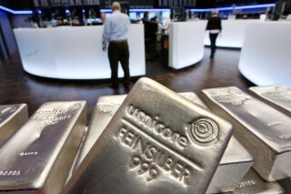 FILE - In this file photo dated Wednesday, May 9, 2007, Silver bullion, bars weighing five kilograms each, are displayed in the trading room of the stock exchange in Frankfurt, Germany.  Silver futures jumped more than 10% on Monday Feb. 1, 2021, following strong gains over the weekend.(AP Photo/Michael Probst, FILE)
