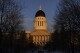 FILE - The Maine State House stands at sunrise, March 16, 2023, in Augusta, Maine. A youth organization and a pair of environmental groups are suing the state of Maine to try to force the state to reduce carbon emissions in the era of climate change. (AP Photo/Robert F. Bukaty, File)